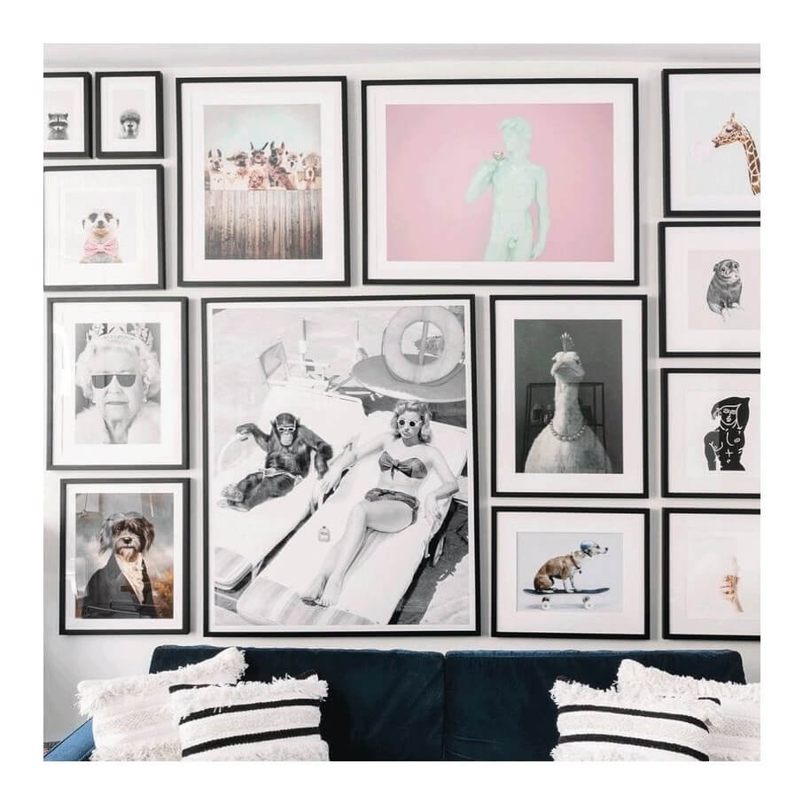 Black and white gallery wall art featuring framed photographs.